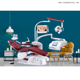 Cadeira odontológica vermelha com bandeja para instrumentos com tela de toque